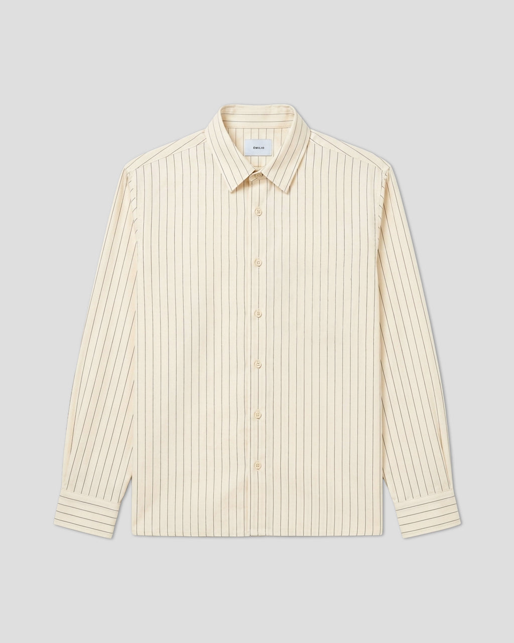 Cream pinstripe oversized shirt laid flat, showing white and cream stripe pattern. Émilio SS26